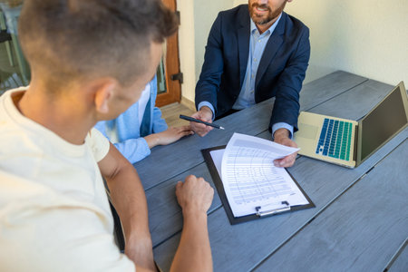 Real estate agent discussing deal details with the clientsの写真素材