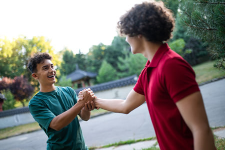 Friends spending time together in the park and looking joyful