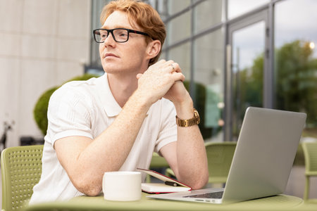 Self-employed man observing distance considering options creating plan
