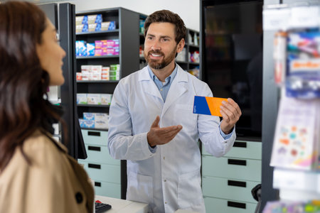 Young dark-haired caucasian woman buying medicines in the pharmacy