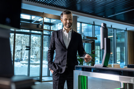 Handsome businessman passing security control in the business center