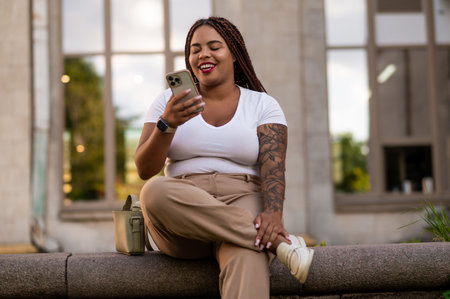 African American woman having online video call on smartphone