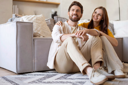 Happy couple feeling contented and peaceful spending time at home