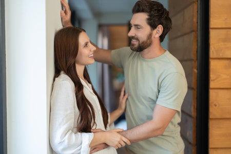 Man and woman talking and looking at each other with interest and loveの写真素材