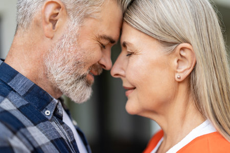 Waist up picture of man and woman face to face to each other feeling peaceful