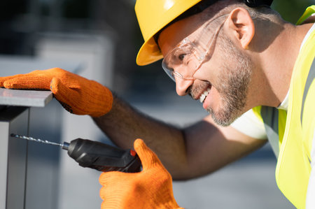 Technician adjusting solar energy equipment ensuring system efficiencyの写真素材