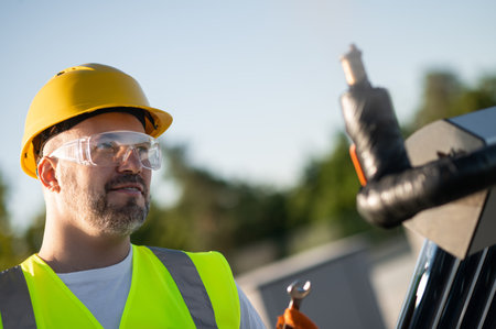 Professional technician working on solar heating structure