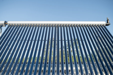 Solar panel close-up on rooftop under blue sky renewable energyの写真素材