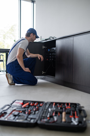 Audio engineer setting up speakers in office
