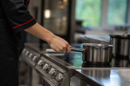 Unrecognizable chef working in restaurant kitchen