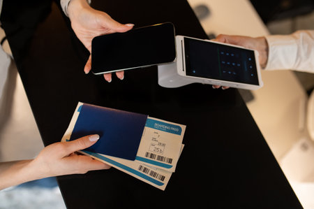 Customer paying for hotel accommodation on reception deskの写真素材