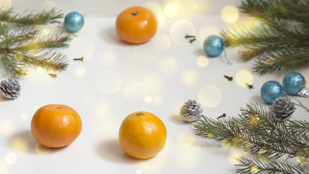 Christmas composition. New Year's decor. Christmas gifts and ornaments on white old background. Copy space. Mandarins.の写真素材