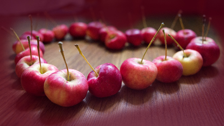 Red apples in the shape of a heart.の写真素材