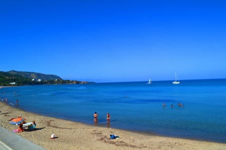 Italian beach with view to sailboatsのeditorial素材