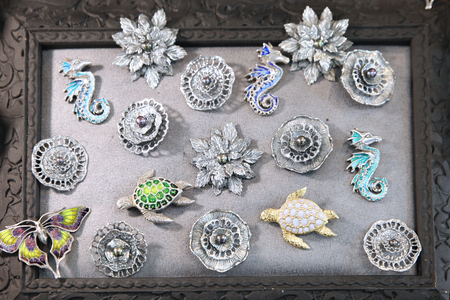 Silver brooches of different shapesの写真素材