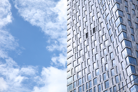 Blue sky and clouds reflected in the building