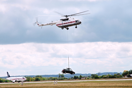 18.08.2009. MAKS-2009. International aviation and space salon, Zhukovsky airfield named after M. M. Gromov. Helicopter Mi-8 of EMERCOM of Russia. Regional passenger aircraft Sukhoi Superjet 100のeditorial素材
