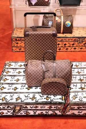 Fashionable suitcases and bags in the luxury Louis Vuitton store. Moscow. 01.11.2018