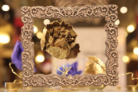Gold flower in vintage gold frame