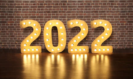 New year 2022, huge retro wooden figures with light bulbs stand on the floor against a brick wall