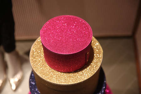Round sparkling gift box standing on top of each other, pink and gold color