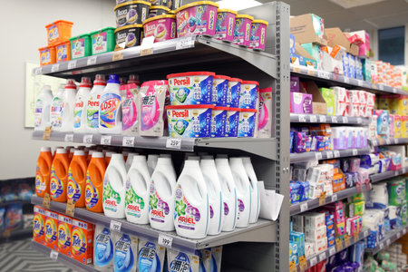 Shelves with Ariel, Persil powder in the household chemicals department, Pyaterochka store. Moscow....