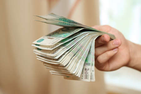 Money in the hands of a young man close-up. Moscow. 03/01/2019