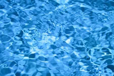 Seamless pattern of blue water in pool.