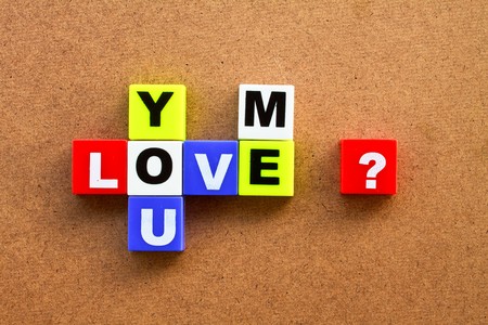 plastic blocks isolated on wood board backgroundの写真素材