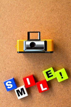 alphabet and camera made by plastic on wood board,for youの写真素材