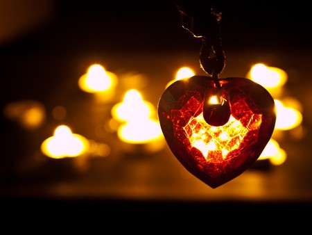 heart in crystal form under candle lightの写真素材