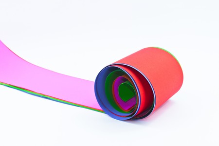 Colored rolled paper isolated in white backgroundの写真素材