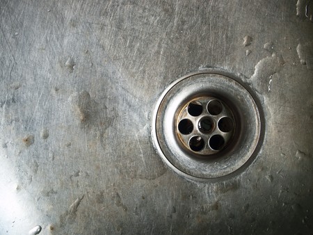 Water running down the drain, deep sinkholeの写真素材