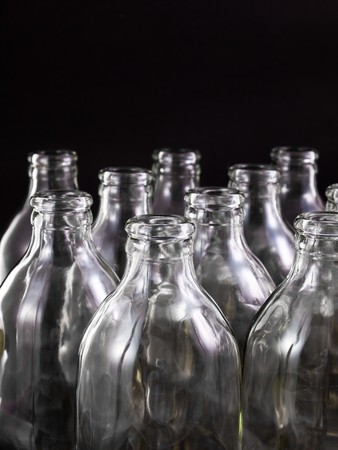 empty bottles collection, colorless, isolated on black backgroundの写真素材