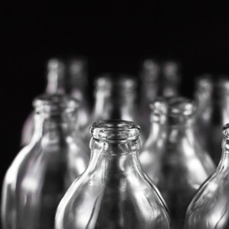 empty bottles collection, colorless, isolated on black backgroundの写真素材