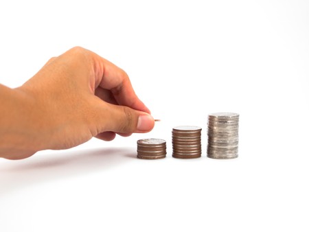 diagram consisting of piles of coins, denotes the artificial creation of the financial crisis