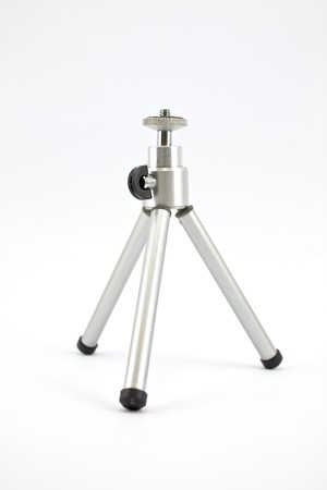 mini silver tripod isolated on white backgroundの写真素材