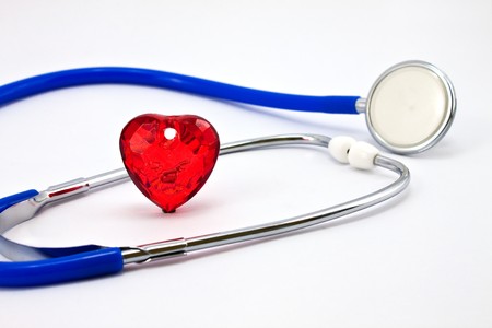 Heart and a stethoscope on a white background. Concept for cardiology.の写真素材