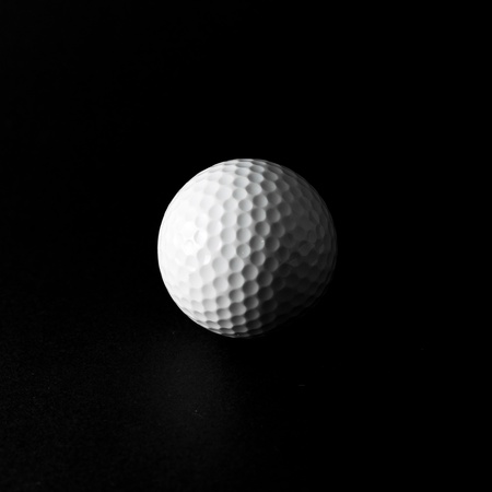 Golf ball closeup in black and whiteの写真素材
