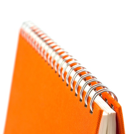 Orange cover of notebook isolated on white backgroundの写真素材