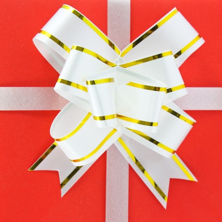 Holiday gift box decorated with ribbon isolated on white background.の写真素材