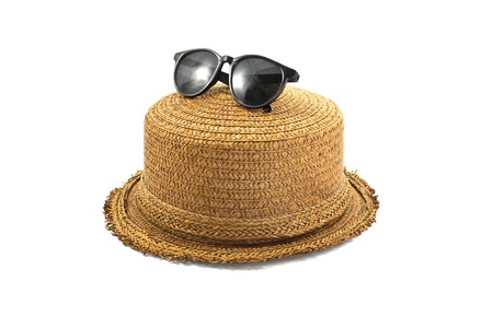 straw hat and sunglasses isolated on a white backgroundの写真素材