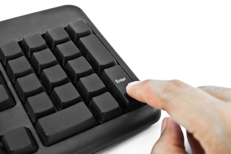 Finger on computer keyboard enter key
