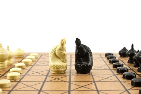fighting between white and black knights on chess boardの写真素材