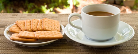 cup of coffee and bread on plateの写真素材