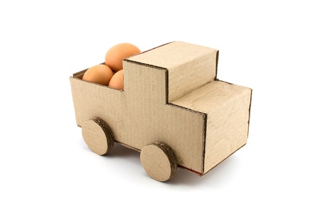 The egg on car model isolated on white backgroundの写真素材