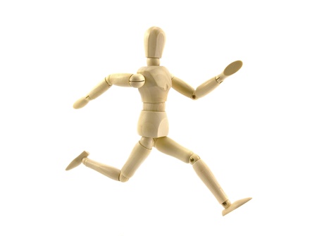 wooden figure mannequin running isolated on white backgroundの写真素材