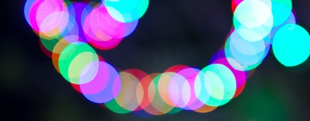 colorful bokeh on black backgroundの写真素材