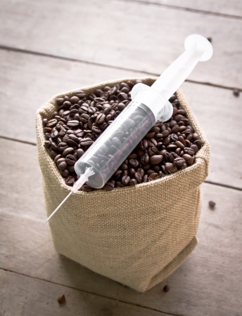 coffee bean and syringe, it's mean to addictiveの写真素材