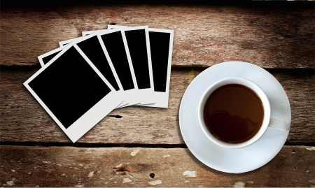 cup of coffee and film on wood boardの写真素材